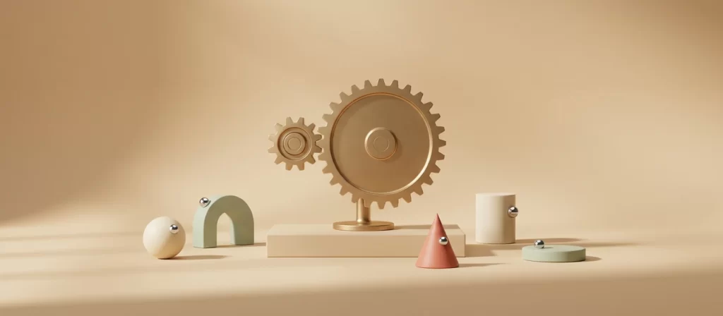 Dos engranajes de latón, uno pequeño y otro grande, encajados sobre un pedestal bajo